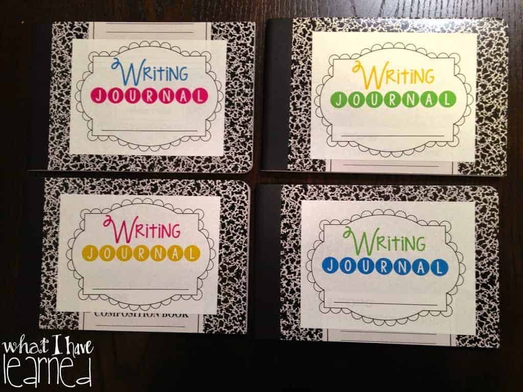 Four writing journal covers are displayed in a grid on a dark background, each labeled "Writing Journal" in colorful text—two with pink, one with green, and one with blue. "What I have learned" appears in the bottom left corner.