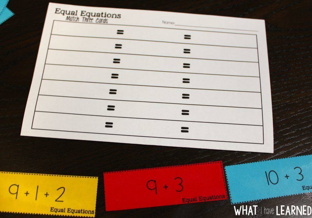 A worksheet titled Using 10 3-min with blank spaces and equal signs sits on a table. Below it are three colorful cards showing math equations, such as 9 + 1 =, 9 + 3, and an equation using 10: 10 - 3.