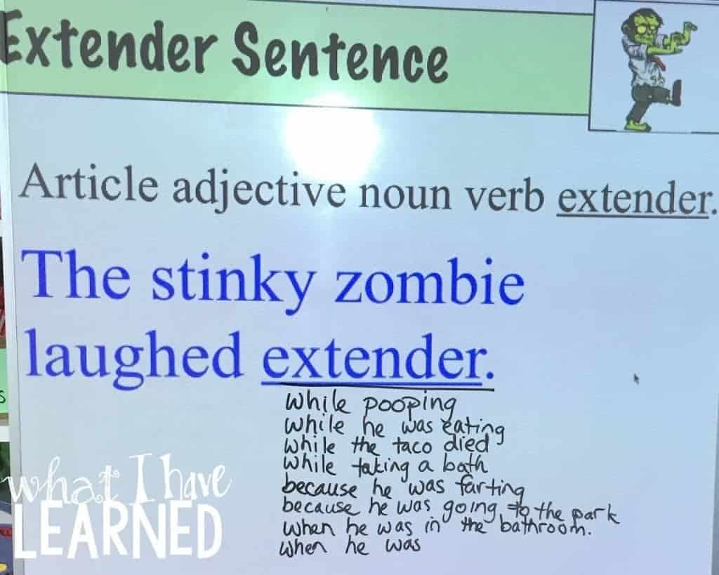 A classroom whiteboard with a sentence-building activity: The stinky zombie laughed ext., along with creative handwritten student phrases like while pooping and while he was eating, sparking ideas for genius paragraphs.