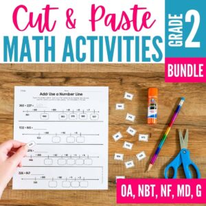A hand carefully completes cut and paste activities on a math worksheet featuring a number line, surrounded by scissors, a glue stick, pencil, and extra worksheet pieces. Text reads 1.