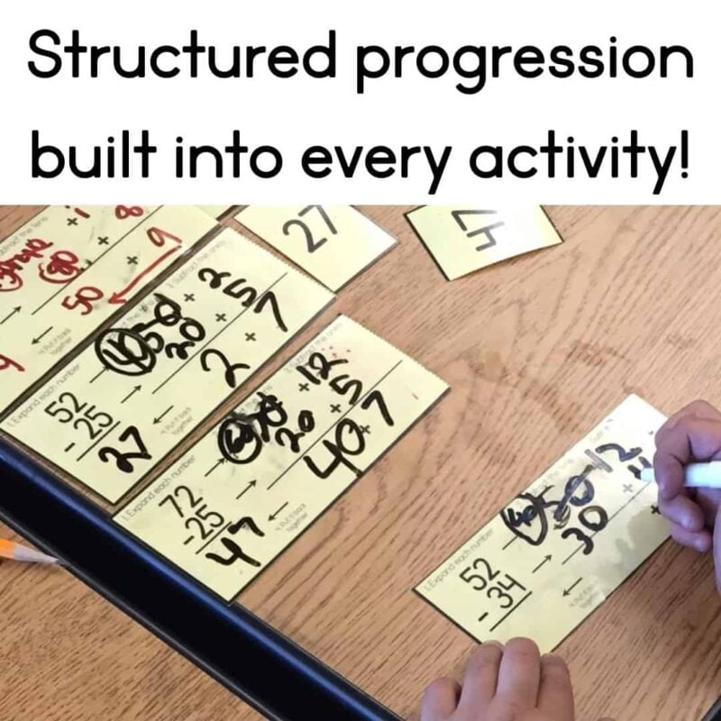 two digit addition & subtraction 8_1 A hand writes answers on a Two-Digit Addition and Subtraction BUNDLE card. Completed cards with handwritten solutions rest on a wooden table. Text above says, Structured progression built into every activity!.