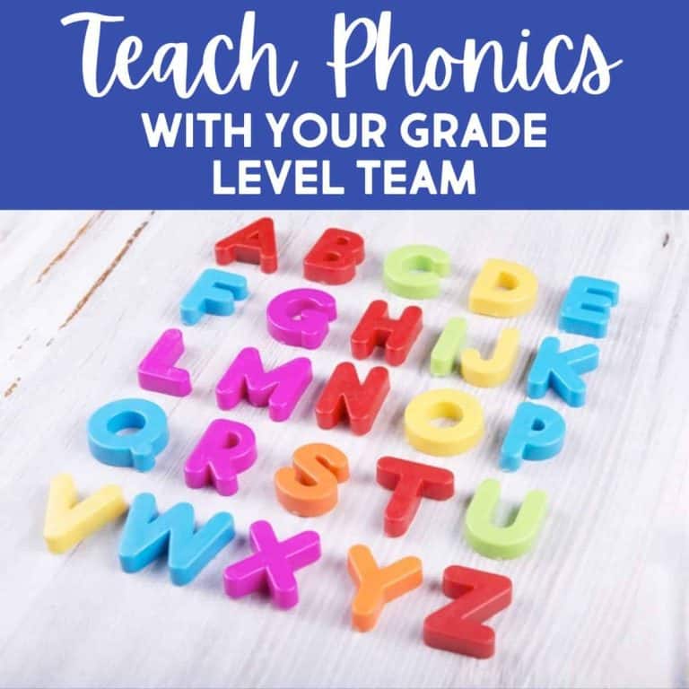 Colorful plastic alphabet letters are scattered on a white wooden surface. Above the letters, text reads, Teach Phonics With Your Grade Level Team in bold white and blue lettering—perfect for those teaching phonics together.