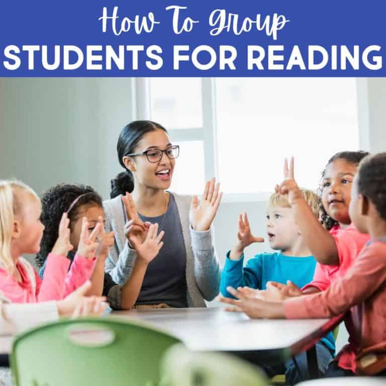A teacher sits at a table with young students, engaging them in a small group reading activity. All are smiling and using hand gestures. Text above reads, How To Group Students For Reading.