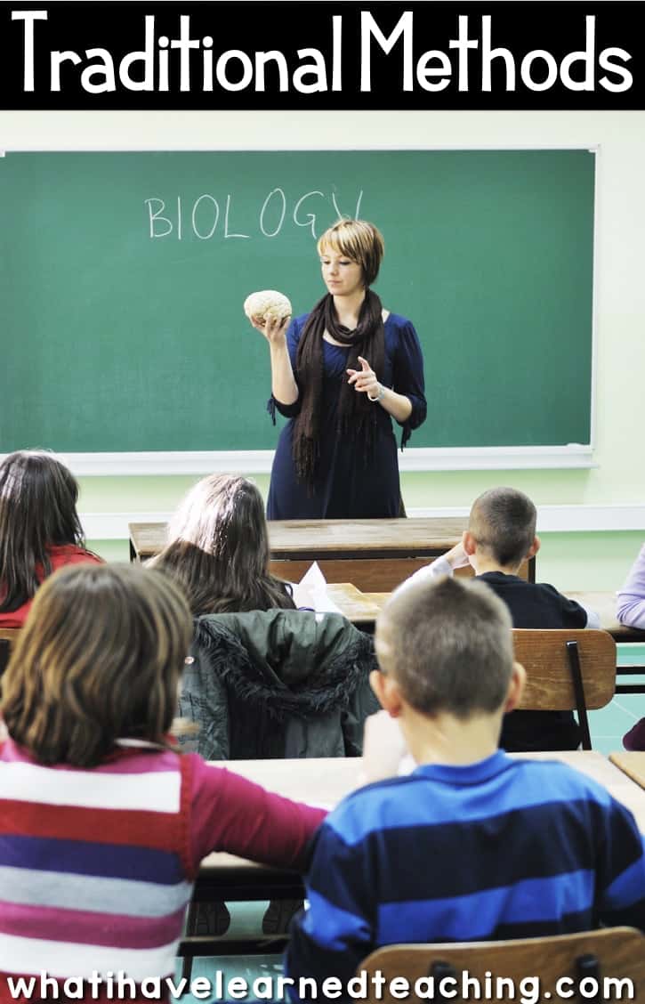 teacher standing in front of the class teaching.