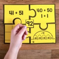 Practice two-digit addition with these fun number puzzles that are great for math centers.