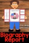 Biography paper craft showing a person holding a folded report about Abraham Lincoln, with facts and his drawing. The product text reads, "Biography Report for any person" and is displayed on a wooden surface.