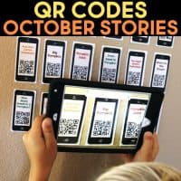october stories qr codes on wall with an ipad scanning them