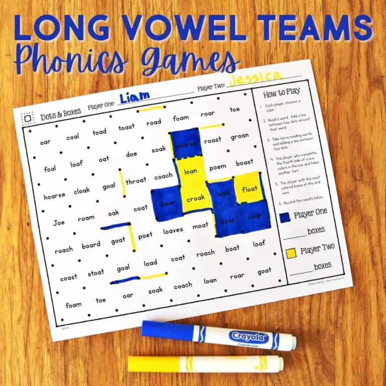 A phonics game worksheet titled Dots & Boxes, a fun vowel team games printable, is on a wooden surface with two colored markers. The sheet has long vowel team words highlighted in blue and yellow, with Liam and Jessica's names at the top.