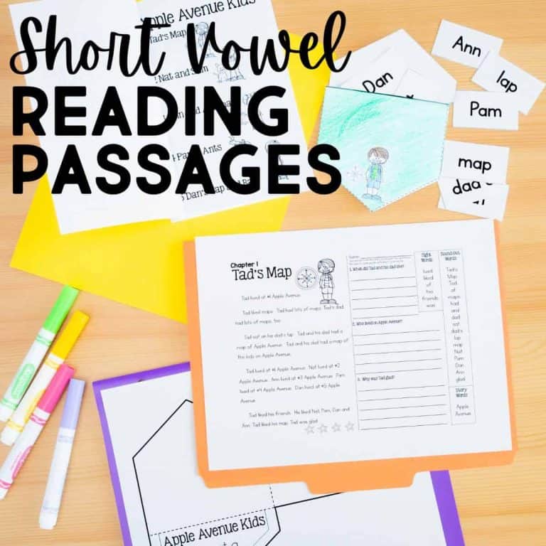 Top view of a desk with Short Vowel Phonics Passages worksheets, colorful folders, markers, and cut-out word cards featuring simple words like Ann and lap—perfect for practicing phonics passages for short vowels.