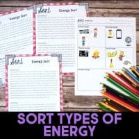 Four worksheets about sorting types of energy are displayed on a wooden surface, along with colorful pencils. The text at the bottom reads, SORT TYPES OF ENERGY.