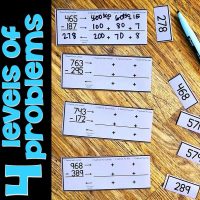 A tabletop displays math cards with three-digit subtraction problems, blank boxes for regrouping, and answer cards. Text on the left reads 4 levels of problems in bold blue letters. A pen is on the table.