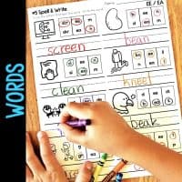 A child uses a purple crayon to complete the Long Vowel Teams AI & AY Worksheets, practicing vowel teams with colorful letter boxes and simple illustrations.