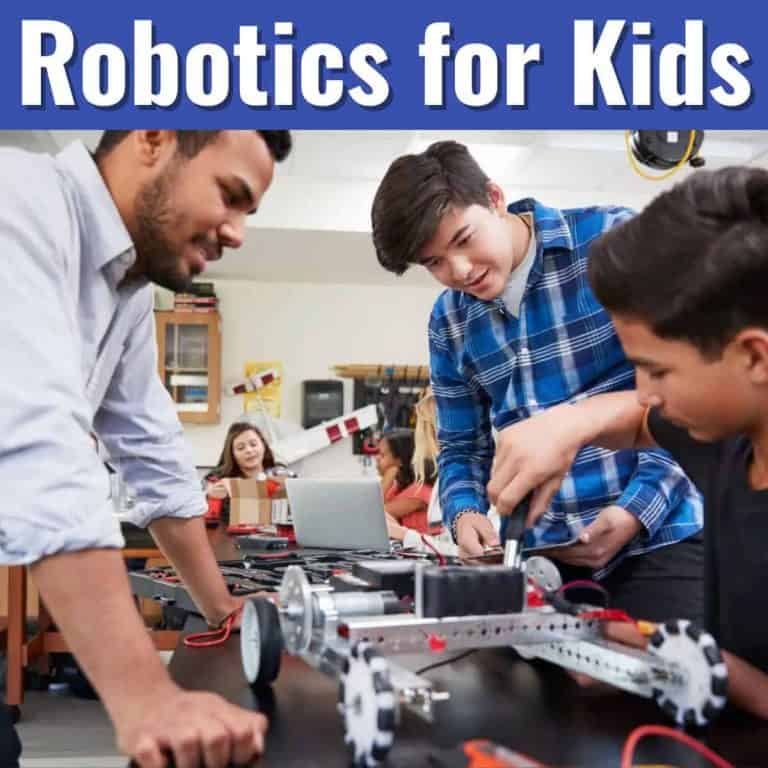 Three students and a teacher work together on building a robotic vehicle in a classroom. Text at the top reads Robotics for Kids. Other students are visible in the background.