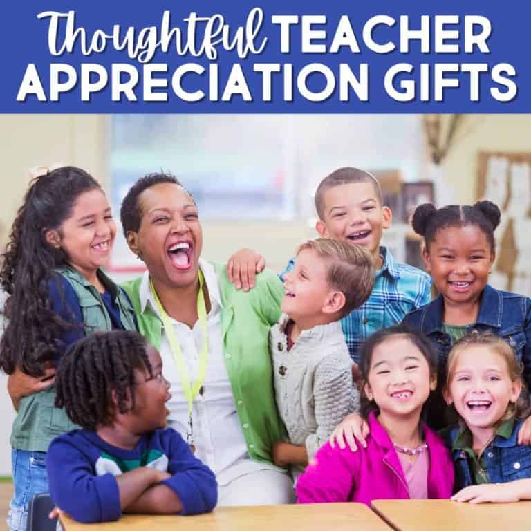 A smiling teacher sits at a table, surrounded by six happy, diverse young students in a classroom. Text above reads, Thoughtful Teacher Appreciation Gifts.