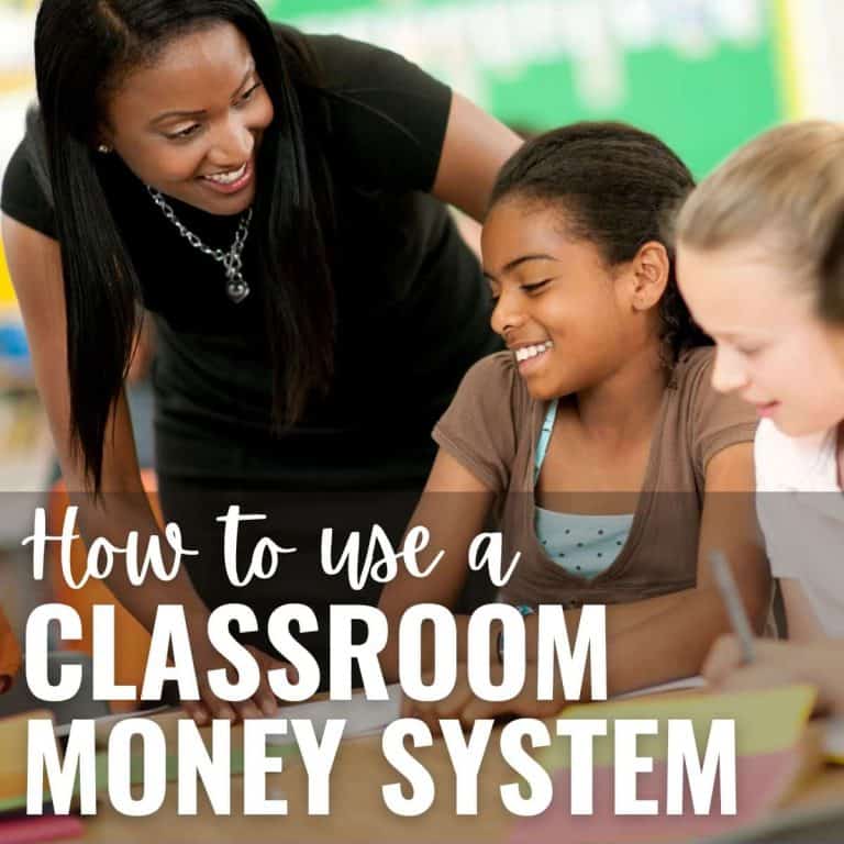 A teacher smiles and leans over two students who are working together at a desk. Text over the image reads, How to use a classroom money system as part of your classroom management plan.