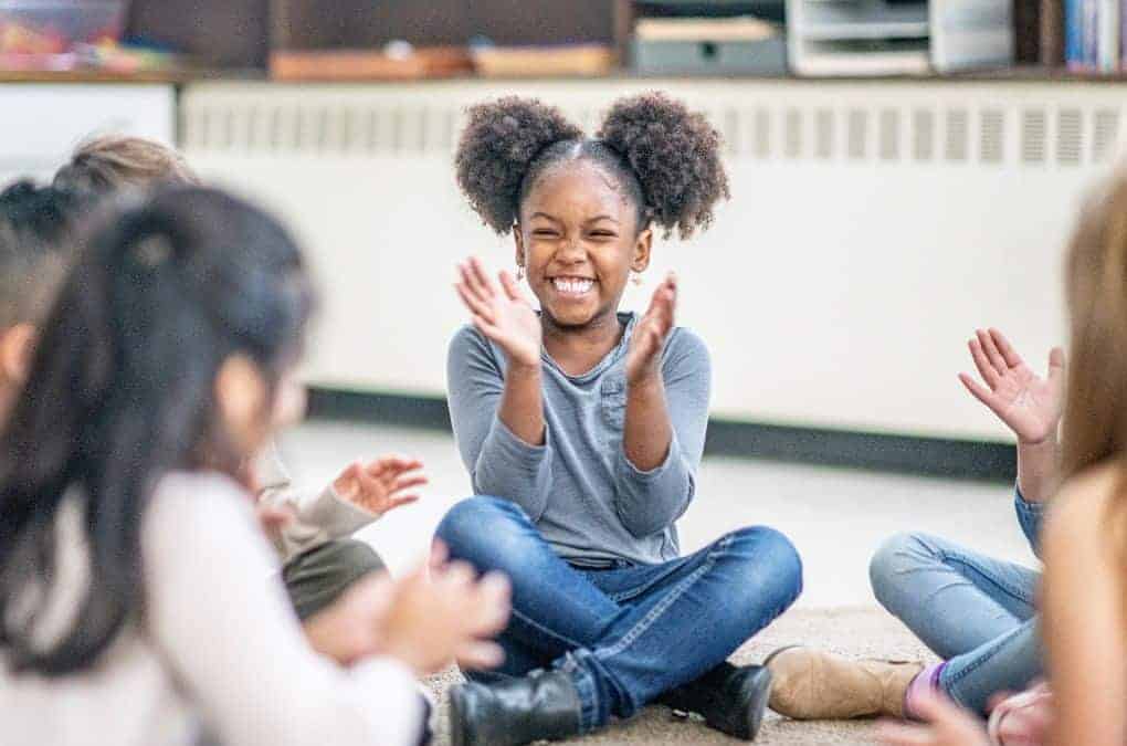 girl clapping to a would you rather question.